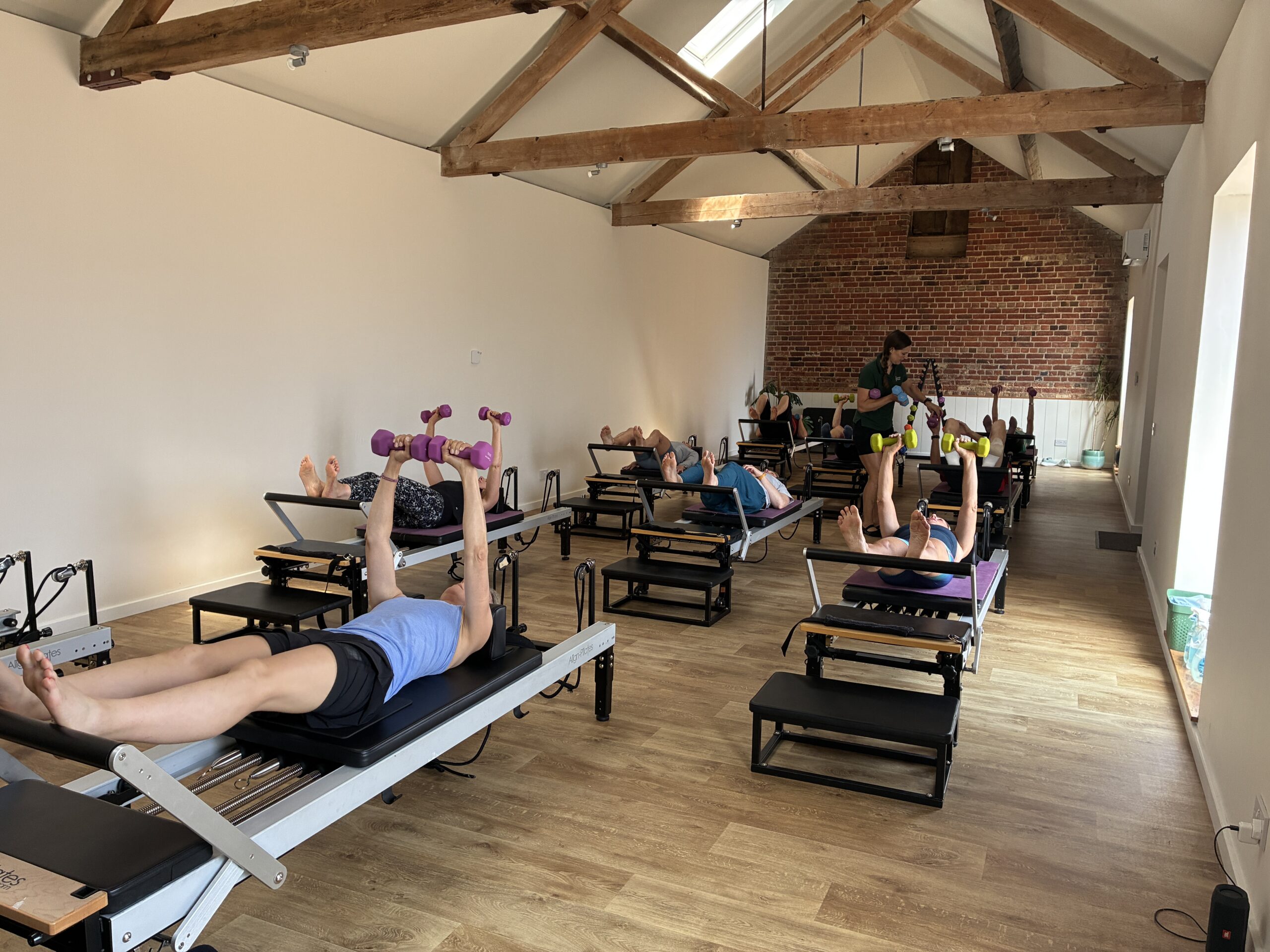 A Reformer Pilates session in progress at Cottesloe Physio, Wing