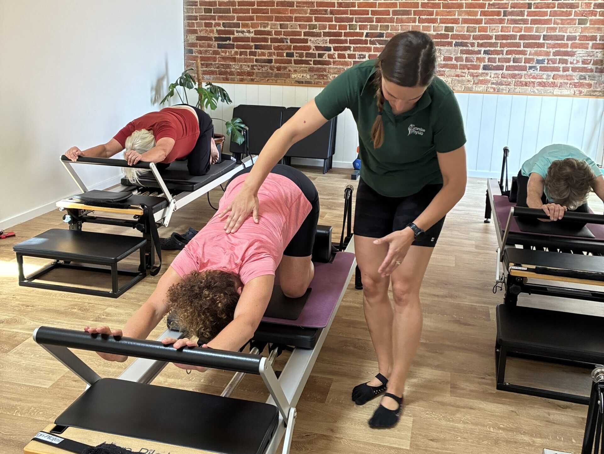 A Reformer Pilates session in progress at Cottesloe Physio